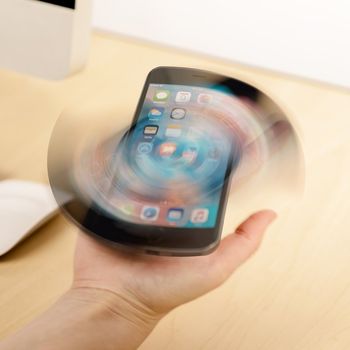 SpinSocket Fidget Spinner, Phone Stand, and Tether Sticks to the Back of your Phone